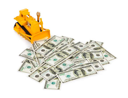 Toy bulldozer and money isolated on white backgroundの写真素材
