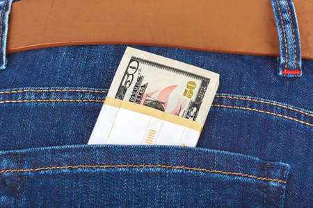 Money in jeans pocket - shopping backgroundの写真素材