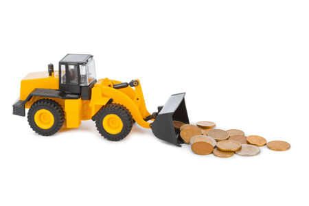 Toy loader and money coins isolated on white backgroundの写真素材