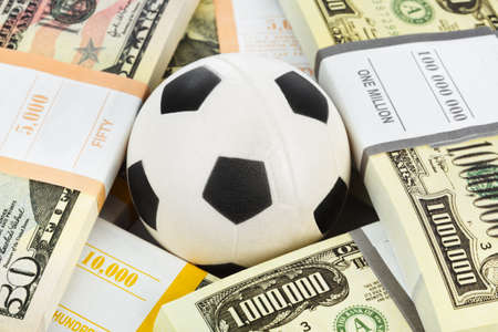 Money and soccer ball - sport and business backgroundの写真素材