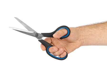 Scissors in hand isolated on white background