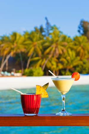 Fruit cocktail on Maldives beach - travel backgroundの写真素材