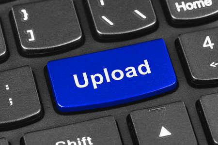 Computer notebook keyboard with Upload key - technology backgroundの写真素材