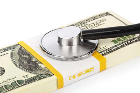 Stethoscope and money isolated on white backgroundの写真素材