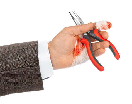 Hand with tool and bandage isolated on white backgroundの写真素材