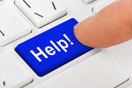 Computer notebook keyboard with Help key - technology backgroundの写真素材