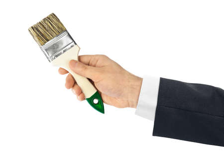 Hand with brush isolated on white backgroundの写真素材