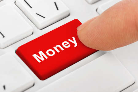 Computer notebook keyboard with Money key - technology backgroundの写真素材