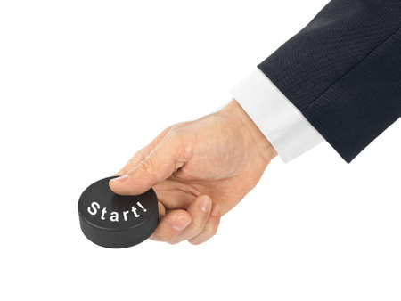 Hand with hockey puck Start isolated on white backgroundの写真素材
