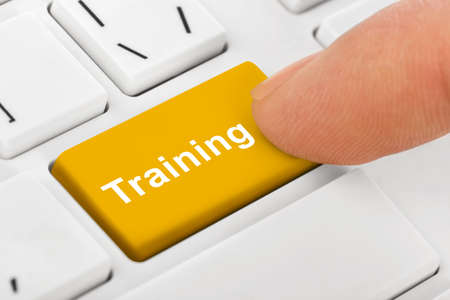 Computer notebook keyboard with Training key - technology backgroundの写真素材
