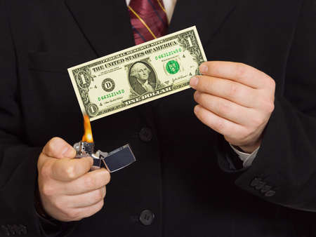 Hands and burnning money - business conceptの写真素材