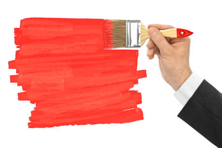 Hand with brush isolated on white backgroundの写真素材