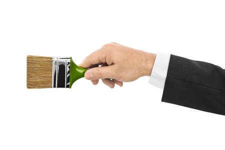 Hand with brush isolated on white backgroundの写真素材