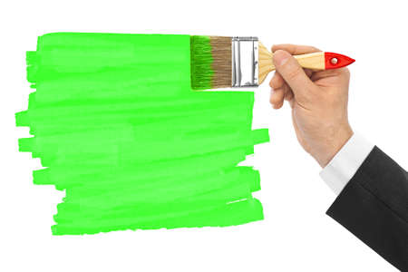 Hand with brush isolated on white backgroundの写真素材