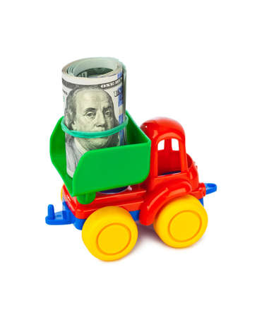 Toy car truck with money isolated on white backgroundの写真素材