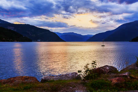 Sunset in fjord Hardanger Norway - nature and travel backgroundの写真素材