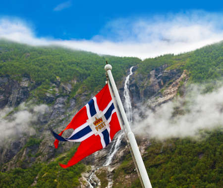 Norway flag and waterfall - nature and travel backgroundの写真素材