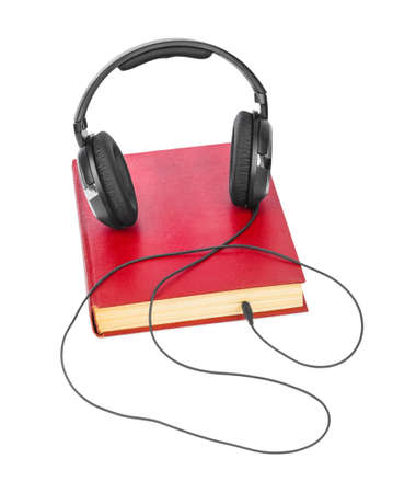 Headphones and book isolated on white background