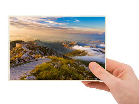 Hand and Lovcen Mountains - Montenegro (my photo) isolated on white background