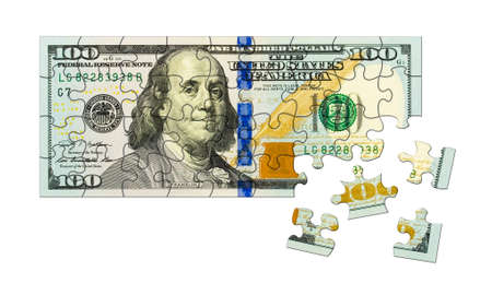 Money puzzle isolated on white backgroundの写真素材