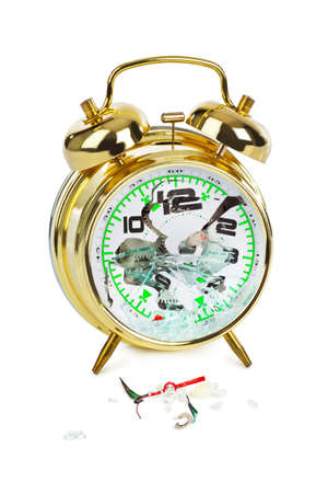 Broken alarm clock isolated on white backgroundの写真素材