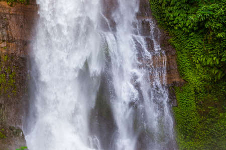 Gitgit Waterfall on Bali island Indonesia - travel and nature background