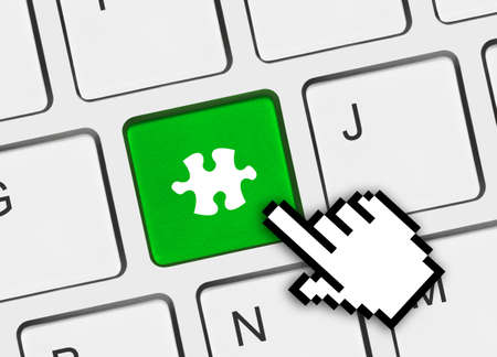 Computer keyboard with puzzle key - business background