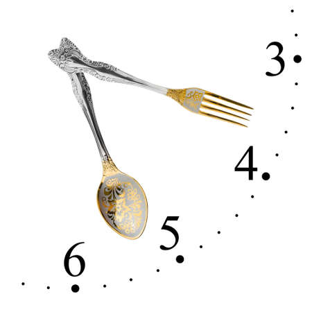 Clock made of fork and spoon isolated on white background