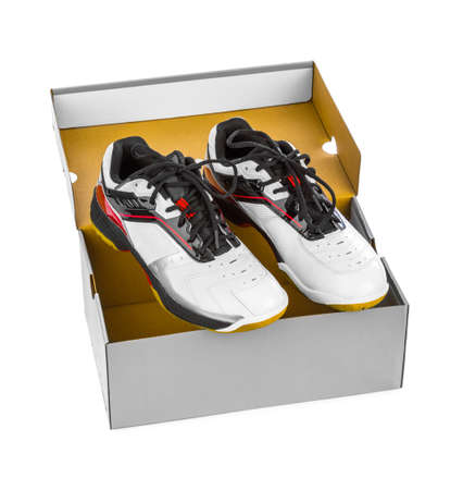 Sport sneakers in box isolated on white backgroundの写真素材