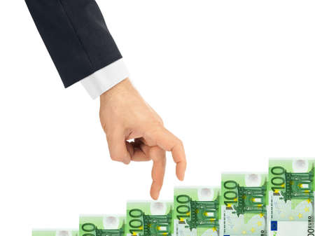 Hand and money staircase isolated on white backgroundの写真素材