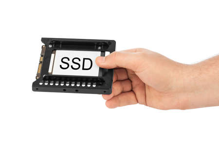 Hand and computer SSD drive isolated on white background
