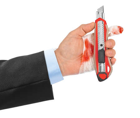 Hand with tool and bandage isolated on white backgroundの写真素材