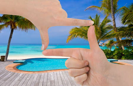 Frame made of hands and beach landscapeの写真素材