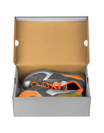 Sport sneakers in box isolated on white background