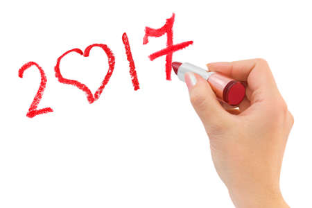 Hand with lipstick drawing 2017 isolated on white background