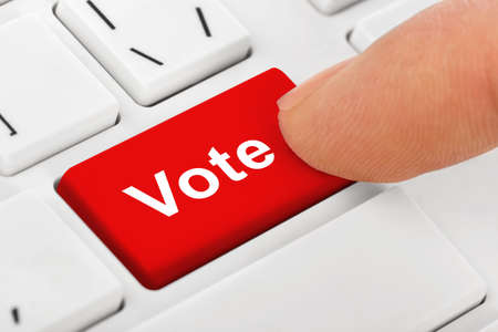 Computer notebook keyboard with Vote key - technology backgroundの写真素材