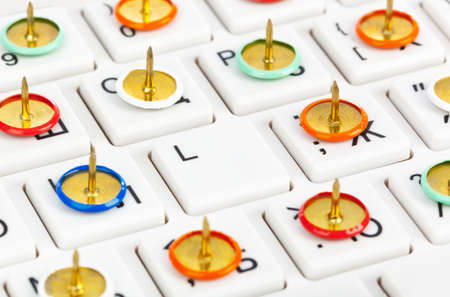 Pins on computer keyboard - concept backgroundの写真素材