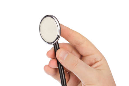 Stethoscope in hand isolated on white backgroundの写真素材