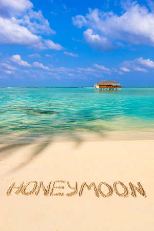 Word Honeymoon on beach - concept holiday backgroundの写真素材