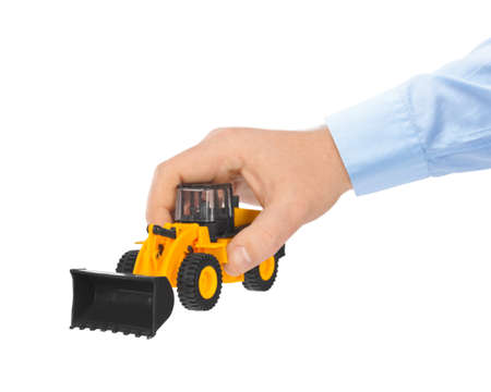 Hand with toy loader isolated on white background
