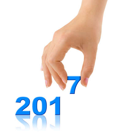 Numbers 2017 and hand isolated on white background