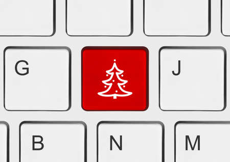 Computer keyboard with Christmas tree key - holiday conceptの写真素材