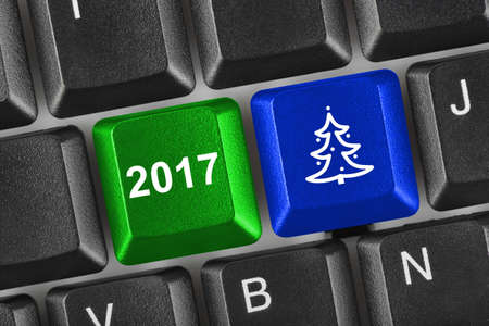 Computer keyboard with Christmas keys - holiday conceptの写真素材