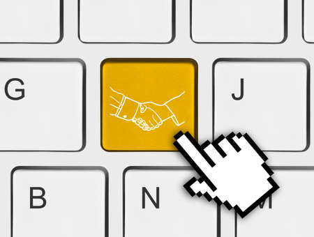 Computer keyboard with handshake button - technology background