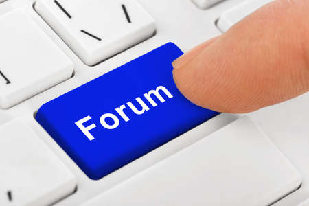 Computer notebook keyboard with Forum key - technology backgroundの写真素材