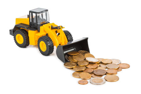 Toy loader and money coins isolated on white backgroundの写真素材