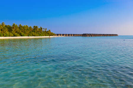 Water bungalows on tropical Maldives island - nature travel backgroundの写真素材