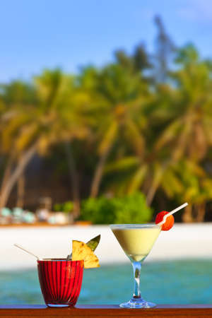 Fruit cocktail on Maldives beach - travel backgroundの写真素材