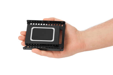 Hand and computer SSD drive isolated on white background