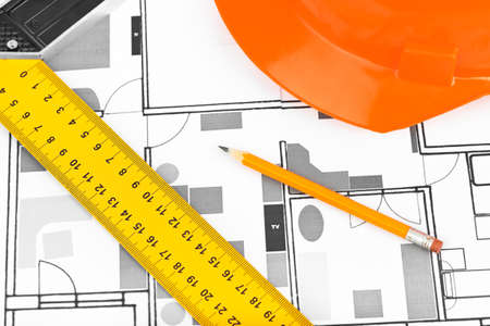 House plan and helmet - construction background